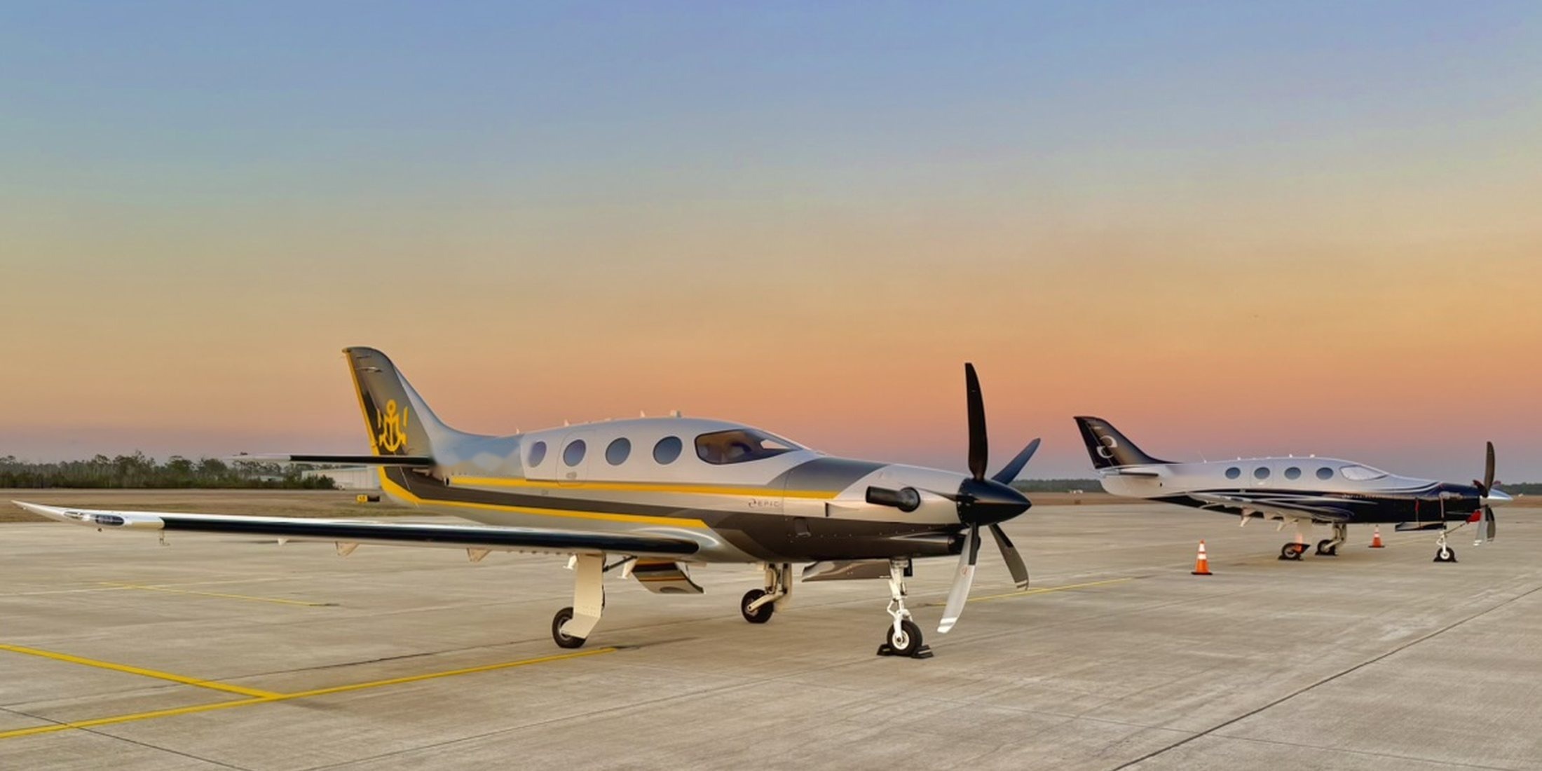 Two Epic E1000s on the ramp at sunset