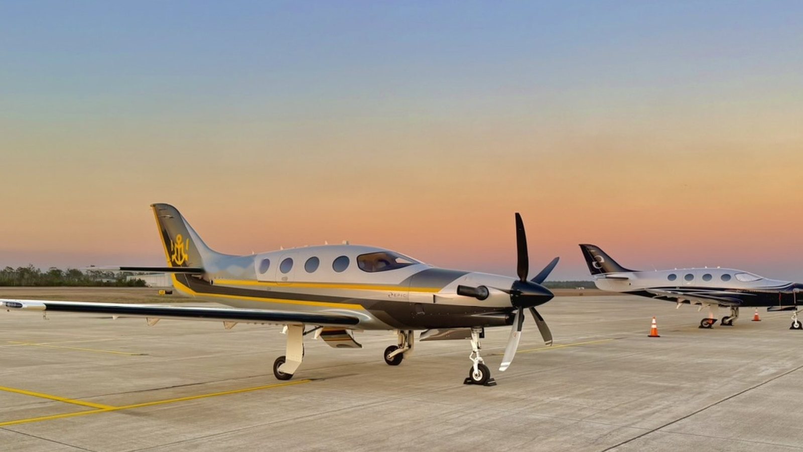 Two Epic E1000s on a coastal ramp at sunset